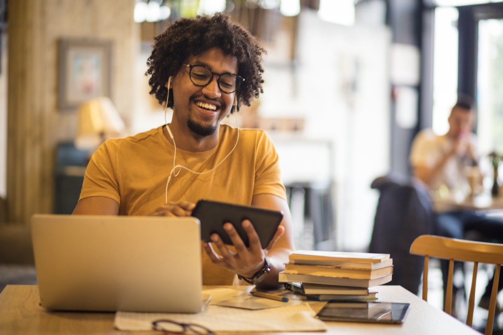 Teacher learning a language using a cell phone.