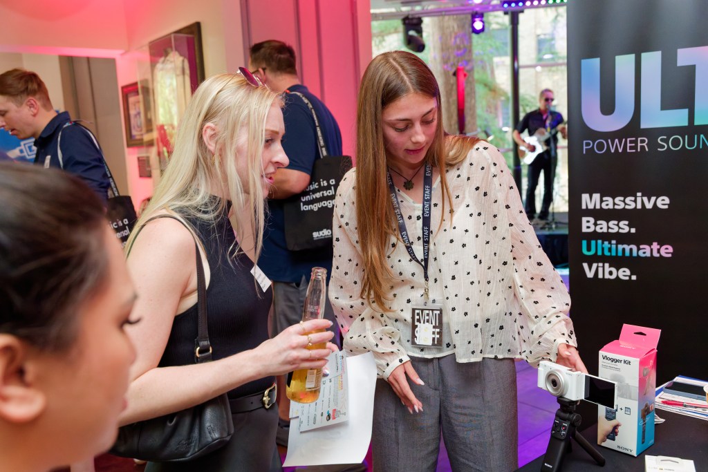 Lady looking at Sony product demonstration