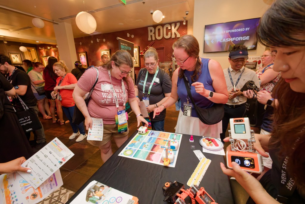 People playing with product at an industry evnet